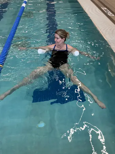 Swimmer using the scissor kick as part of a swim workout