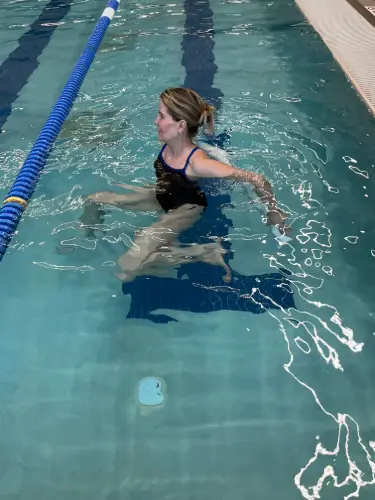 Swimmer using the bicycle kick as part of a swim workout