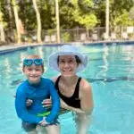 Swim Coach Vee with student swimmer learning how to swim