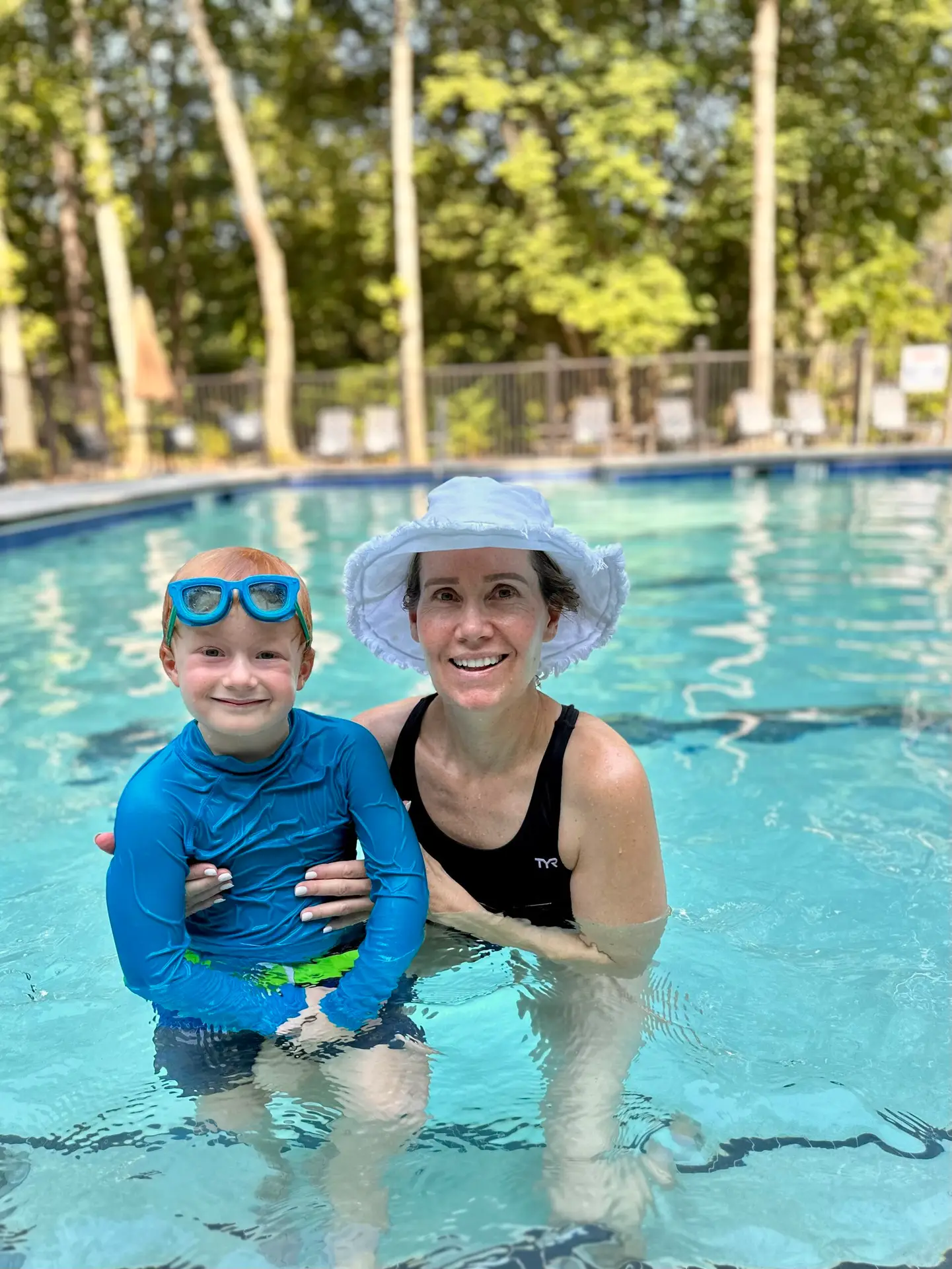 Swim Coach Vee with student swimmer learning how to swim