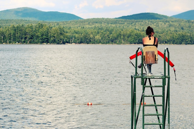 Lifeguard on Duty Watching over a lake in a high tower