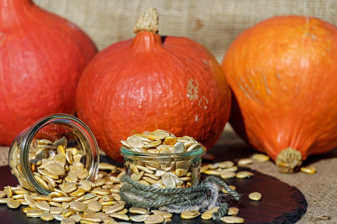 Pumpkins and pumpkin seeds displayed on a table