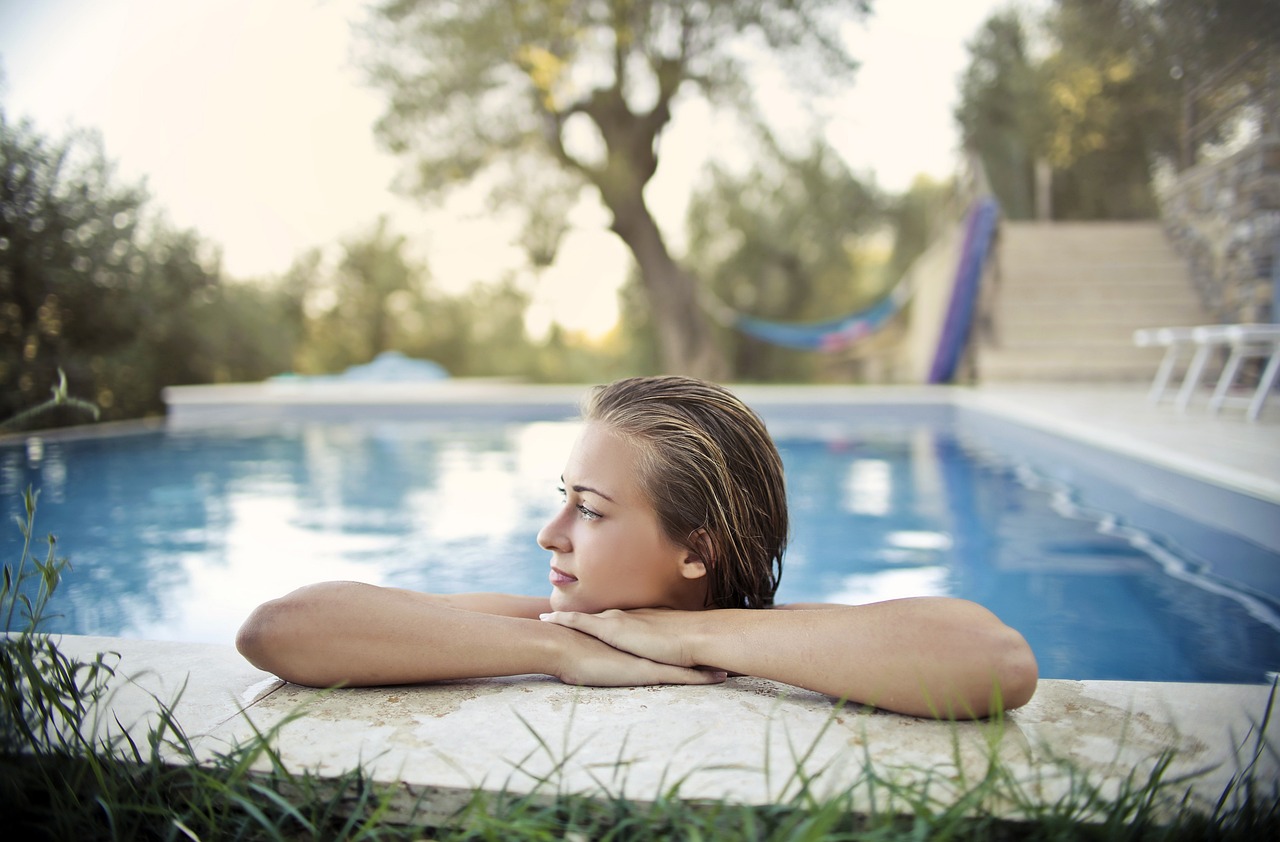 female swimmer relaxing in a swimming pool