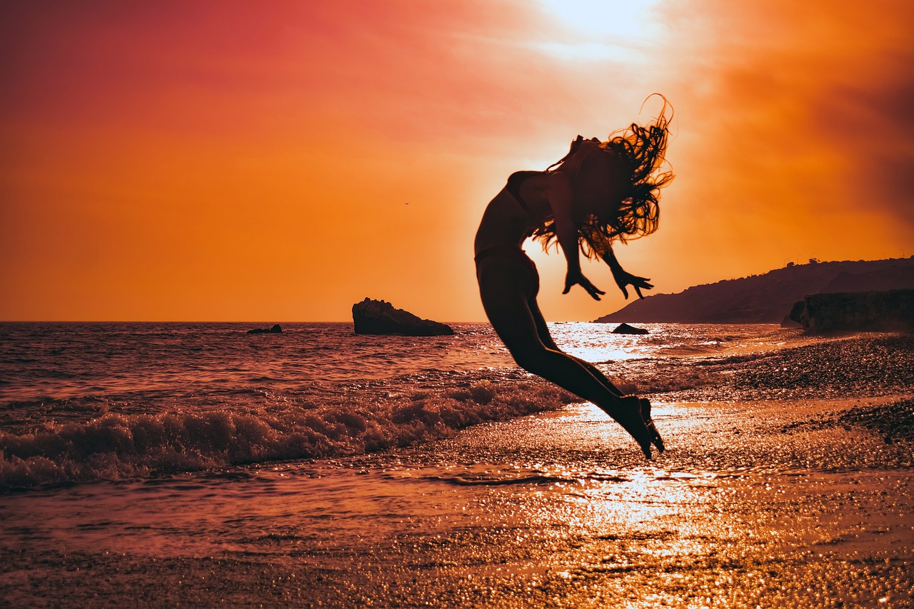 Woman enjoying happy in life on beach summer
